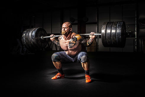 Strong man doing power squat