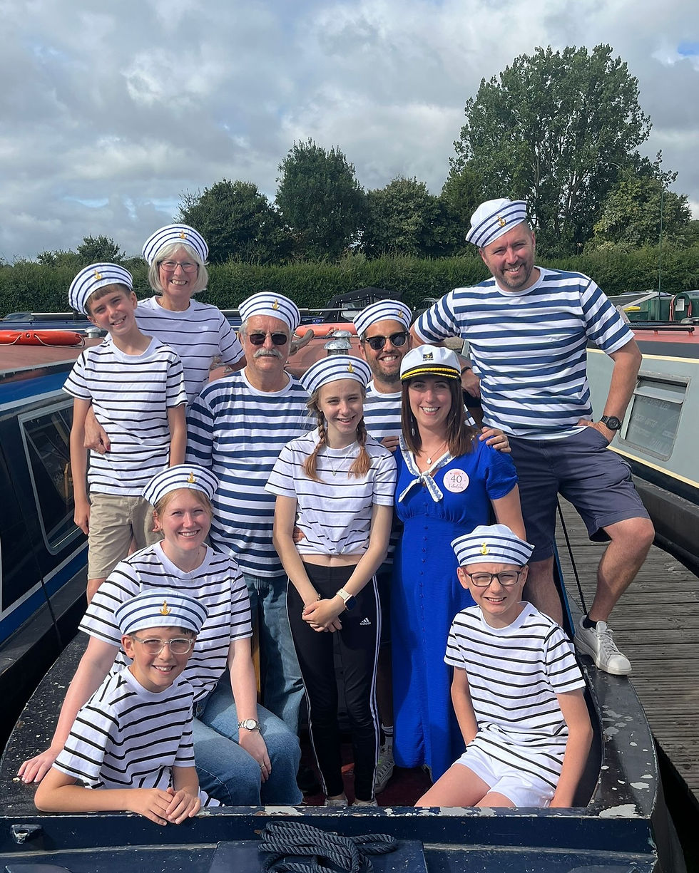 Group of friends enjoying a narrowboat day hire on the Grand Union Canal