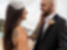 bride and groom under veil