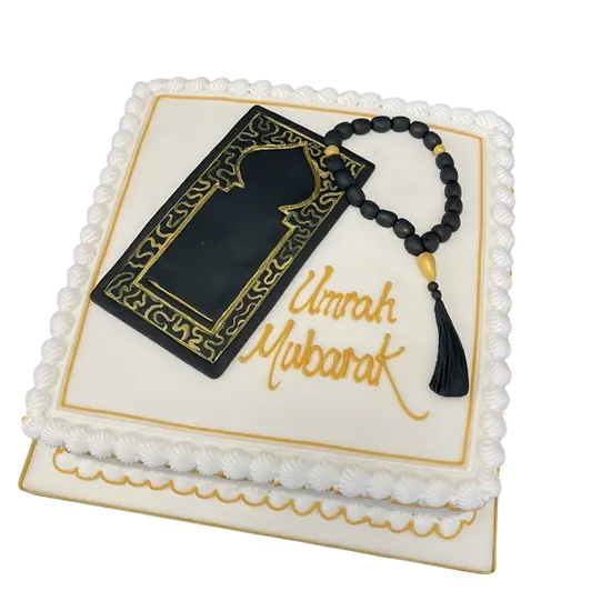 Bespoke Umrah Mubarak cake with detailed prayer mat and beads design, crafted in Solihull, West Midlands celebration.