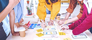 Young Asian business creative team work together, mobile application software design proje