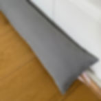 grey Waterproof draught blocker on white wooden door