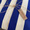 Thumbnail: royal blue and white stripes counter valance with jute string and Scandalo al sole Kraft label