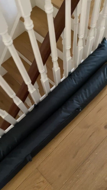Thumbnail: dark grey waterproof draught excluder with pulling hoops.