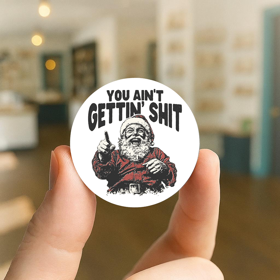 a white 25mm pin badge with a vintage-style illustration of Santa laughing and pointing, with bold black text