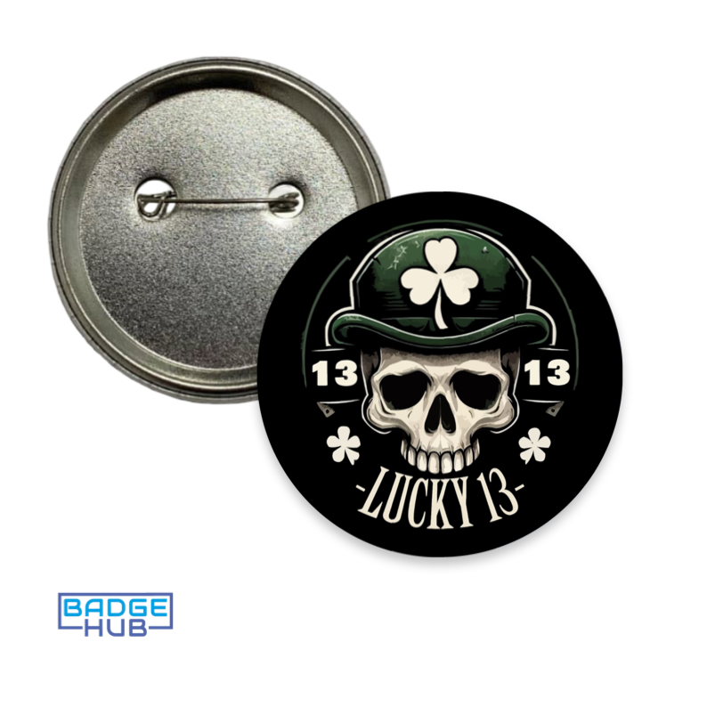 Back and front view of a badge showing a skull in a green shamrock hat with “Lucky 13” text