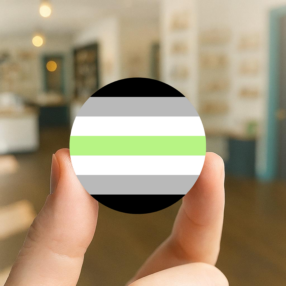 25mm pin badge featuring the agender pride flag with black, grey, white, and green stripes.