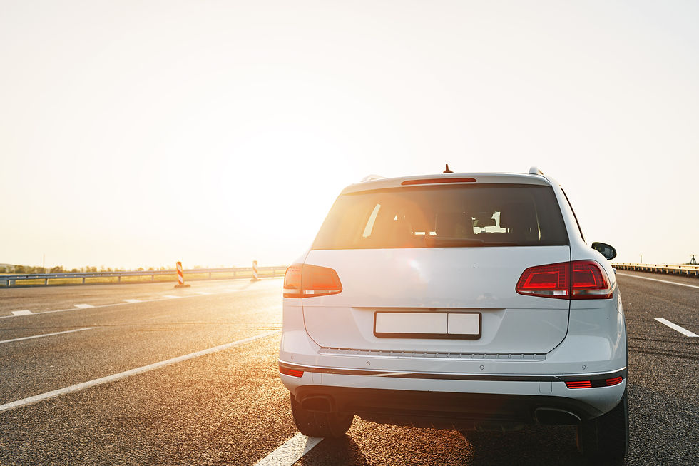 white-crossover-car-on-empty-asphalt-road-at-sunri-2023-11-27-05-17-53-utc.jpg