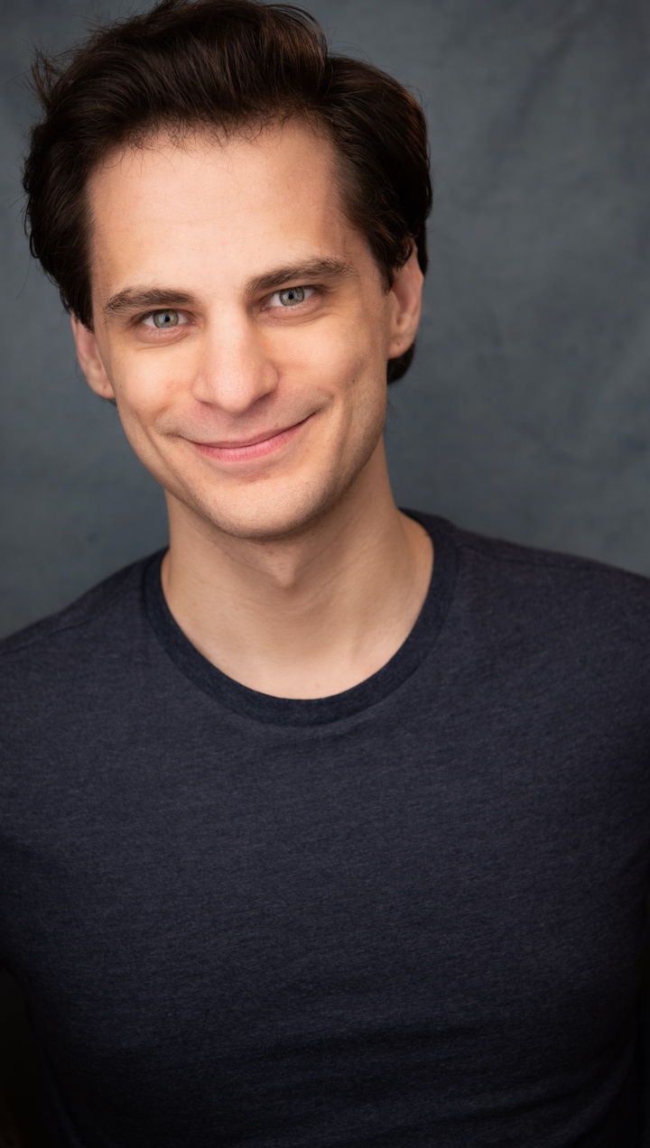 Blue Background half smile.jpeg