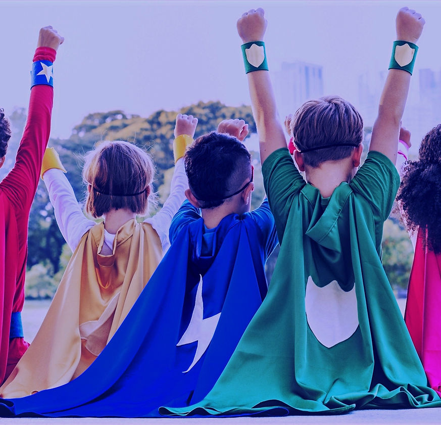 Children dressed as superhero's, with their hands in the air
