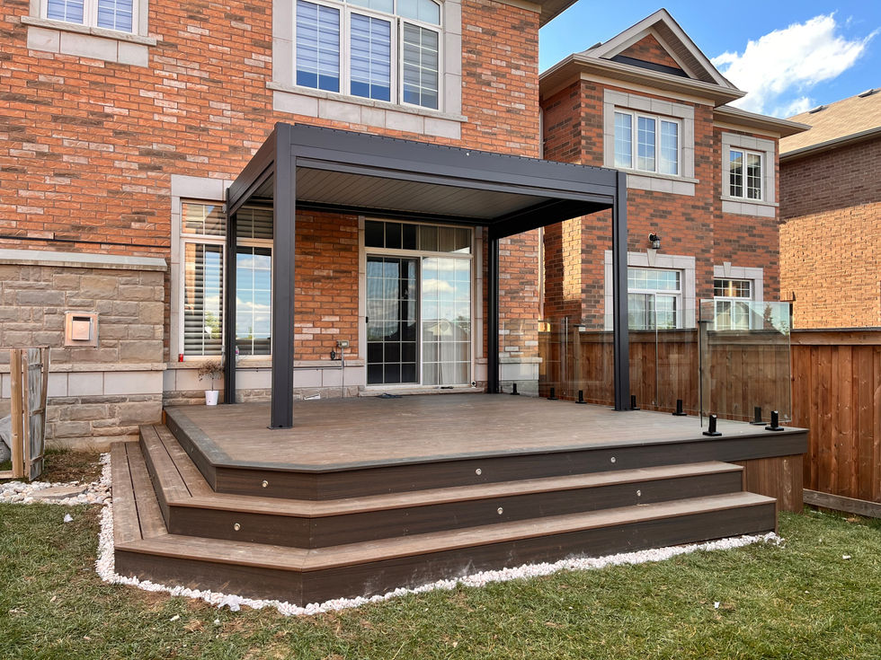 Stylish multi-tier deck with pergola and outdoor lounge furniture