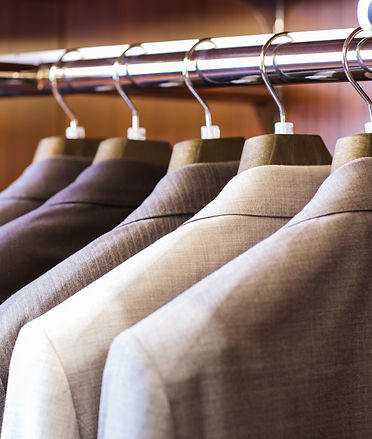 suits hanging on rack