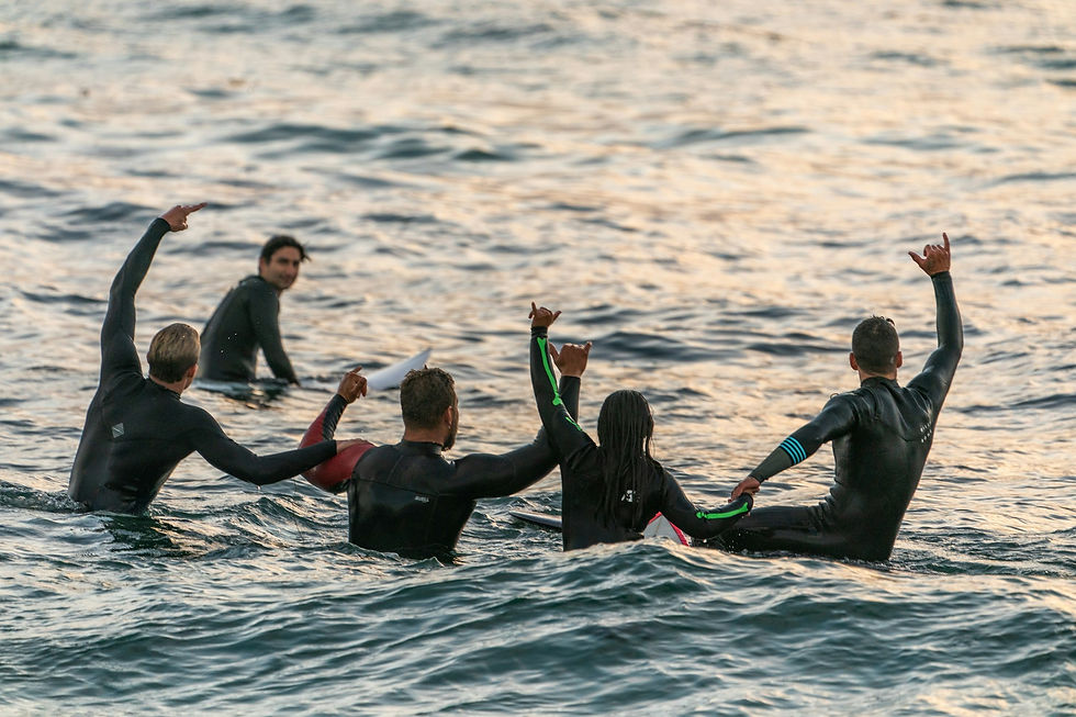 photo - surfers exclaiming cheehoo and other hawaiian greetings during the waikiki surfing session