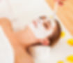 Therapist applying a face mask to the fa