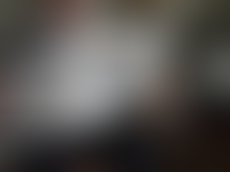 Person holding a newspaper featuring the documentary SEIZED, highlighting coverage of the 2023 Marion County Record police raid and themes of press freedom and journalism.