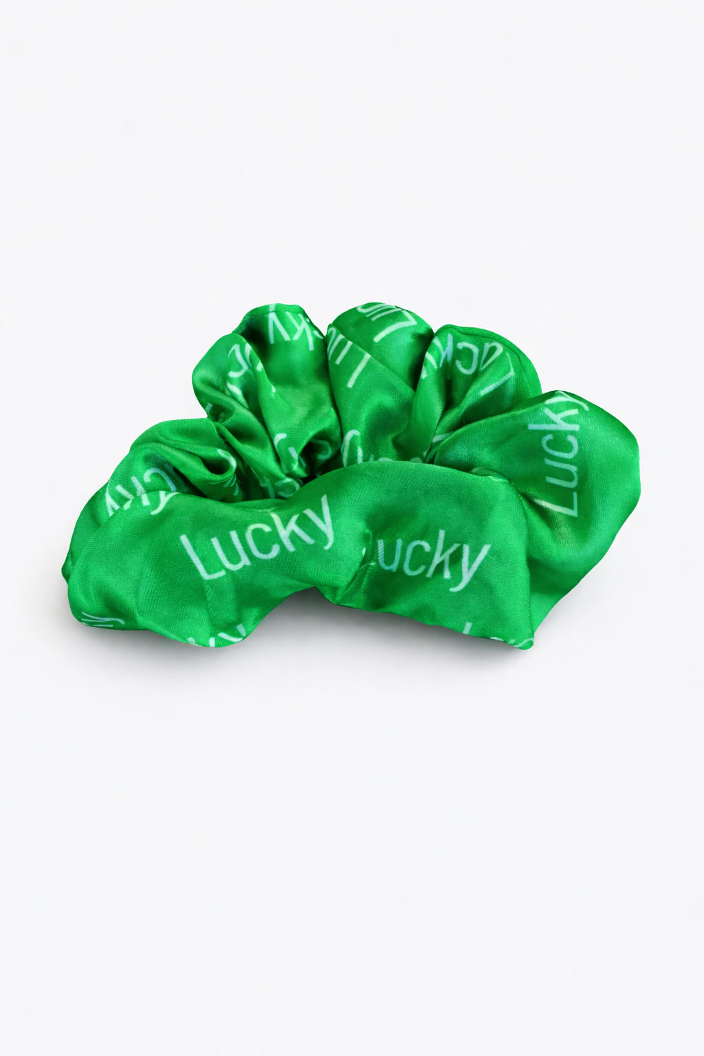 Shamrock bright green St. Patrick's Day hair scrunchie to manifest Luck! Hair scrunchie says Lucky all over with elastic.