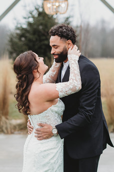 bride and groom hugging