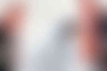 grooming dipping bride and kissing her at the front of the ceremony space