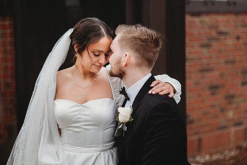 close up of bride and groom forehead to forehead