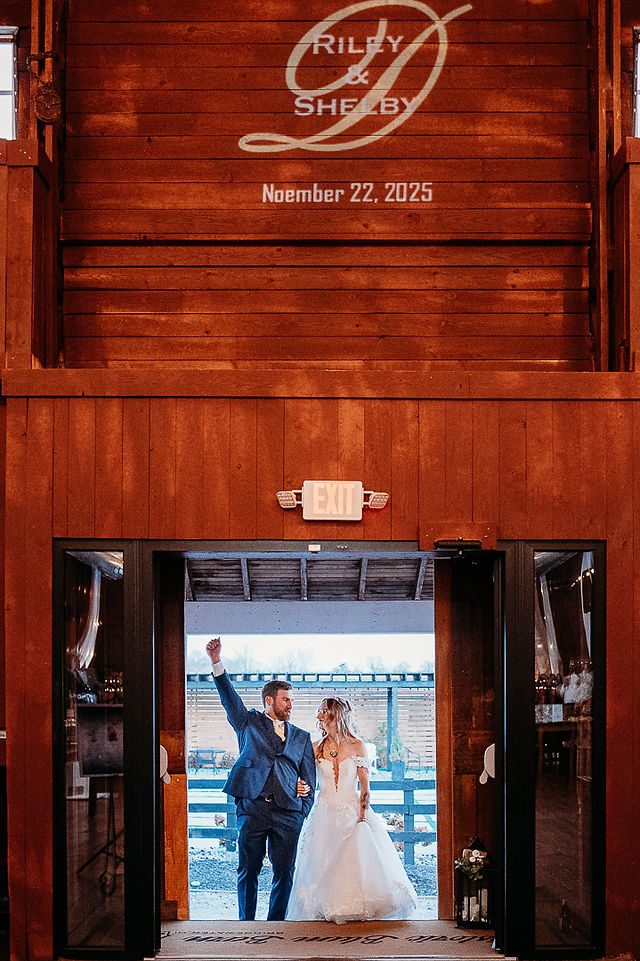 bride and grooms entrance into Historic Blum Barn