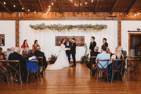 bride and groom exchanging vows at Wester's