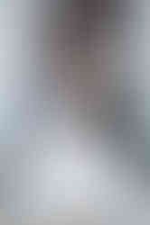 Bride and Groom standing back to back reading vows to one another