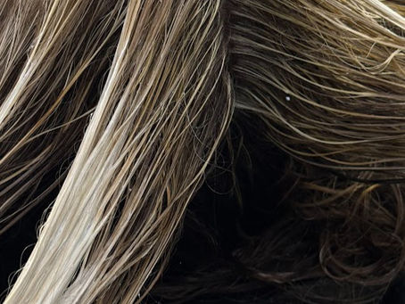 a wet balayage in a shampoo bowl to brighten the ends of a lived in blonde
