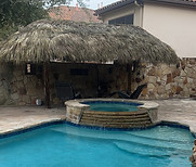 Poolside palapa structure for Houston backyard pool area