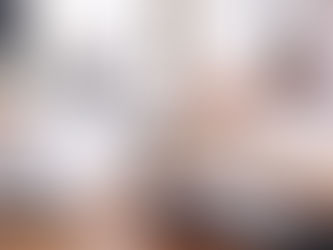 A paralegal sitting at her desk with office supplies, a pen in her hand, and a calendar.