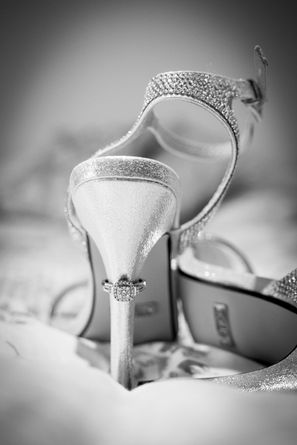 Bride’s wedding shoes with diamond engagement ring at Parley Manor