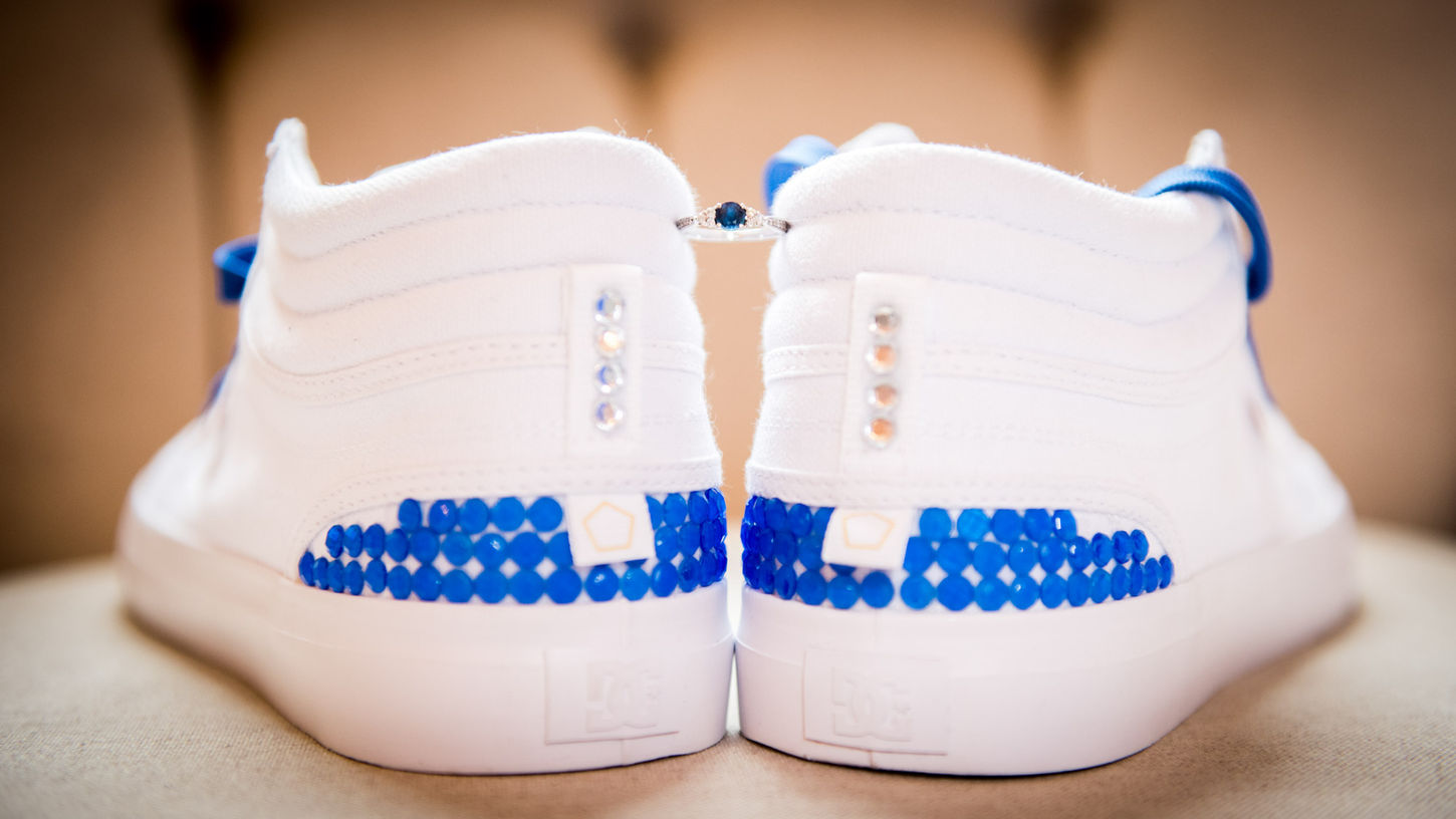 Custom white wedding trainers with blue detailing and sapphire engagement ring in Bournemouth