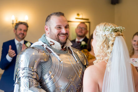 Groom smiling during wedding ceremony at Elmers Court Hotel.