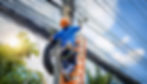 generate an image a male internet technician wearing blue shirt and blue helmet installing