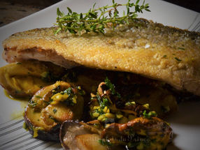 Filet de bar sauvage sur poêlée de cèpes et oronges