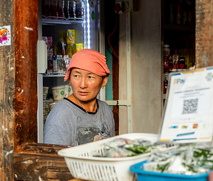 Local Bhutanese vendors selling fresh organic vegetables and fruits at an open market in Tashigang