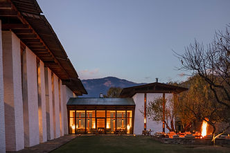 Aman Kora Bumthang luxury resort featuring traditional Bhutanese architecture set amidst serene valleys and forested mountain