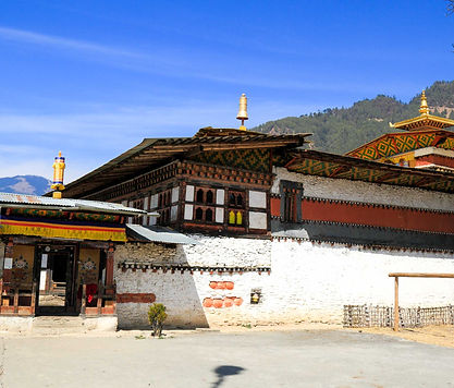 Historic Tamshing Monastery perched on a hillside, known for its ancient murals and spiritual significance in Bhutan