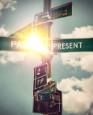Street signs that say Past. Present. Fut