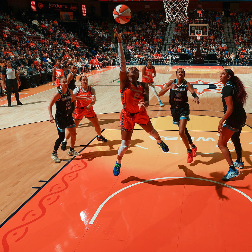 Sun player driving to the rim shooting a layup