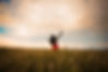 girl-is-raising-her-arms-enjoys-with-nature-fleshy-wheat-ears-fields-summer-crop_290431-80
