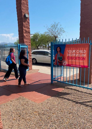 Image of campaign asset outside on a fence