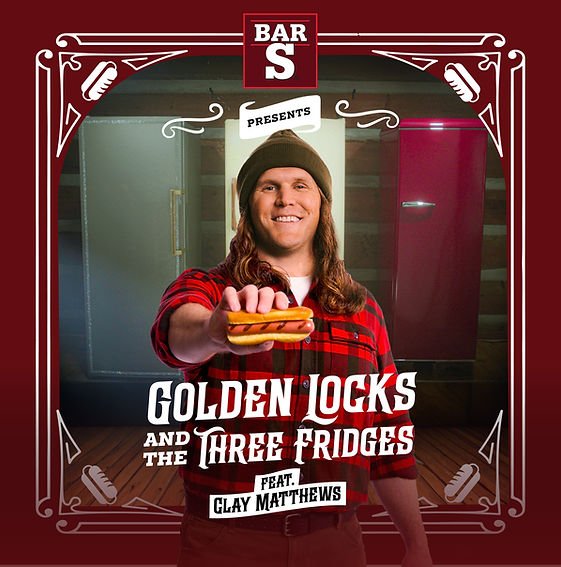 A cheerful Clay in a red plaid shirt holds a hot dog in front of three fridges. Text reads "Golden Locks and the Three Fridges feat. Clay Matthews."