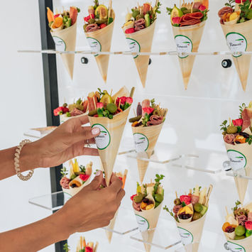 Hands grabbing a cone filled with Fiorucci Product 