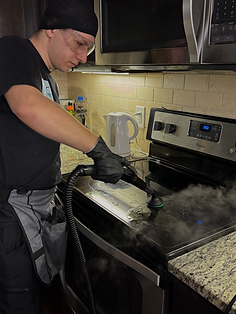 Steam cleaning stovetop using steam vacuums