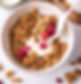 milk pouring into granola bowl.jpg
