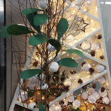 A Christmas display with decorations made from recycled paper. 