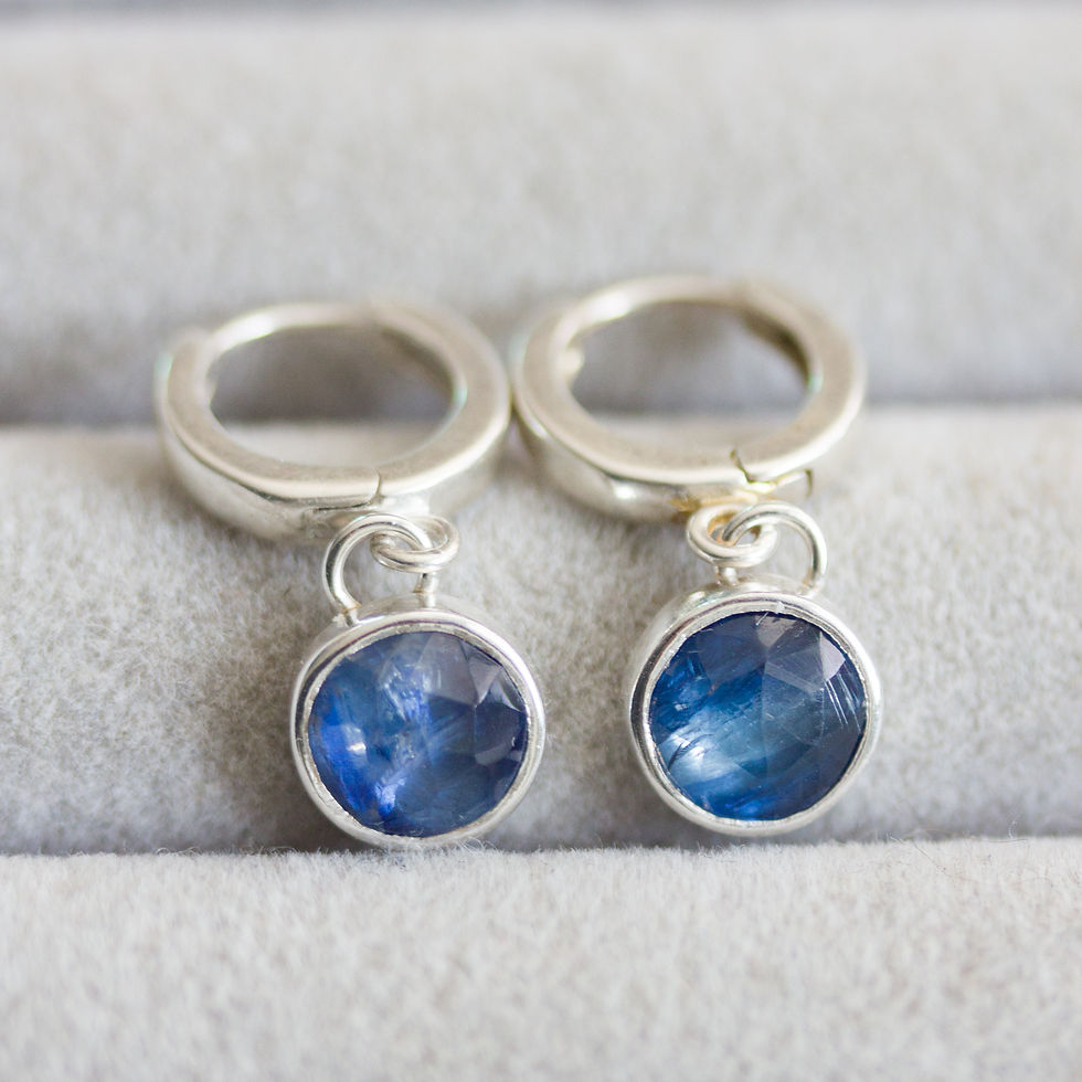 Thumbnail: Huggie earrings with dangling blue kyanites in sterling silver