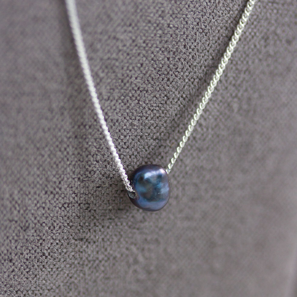 Thumbnail: Sterling silver necklace with a dark blue keshi pearl bead