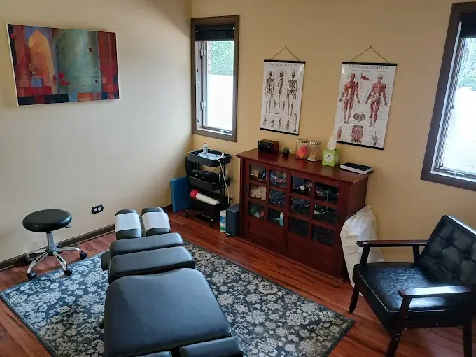 Eye-level view of a calm chiropractic office with a treatment table