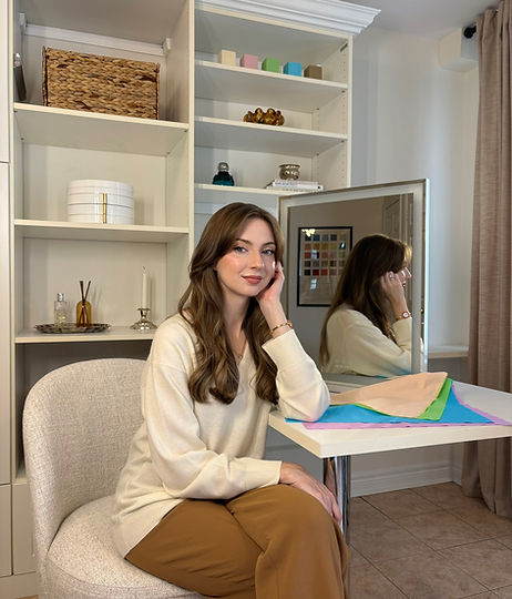 Rebecca Lindzon seated with colour drapes in her private Toronto colour analysis studio
